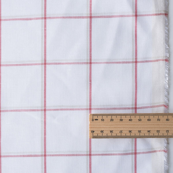 Harmony Checks Linen Blend Fabric. A lightweight linen-cotton blend fabric with a plaid pattern of thin red stripes forming a grid on a light beige background, indicating a composition of 52% linen and 48% cotton and a weight of 135 GSM.