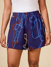 Navy shorts with rope pattern worn by a person on a beige background