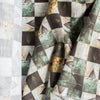 Nature-inspired Botanical Patchwork Linen Blend Fabric with green, beige, and brown leaf patterns
