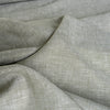 Subtle green and white blended linen fabric, perfect for creating sophisticated and airy garments.