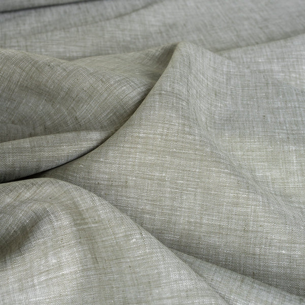 Subtle green and white blended linen fabric, perfect for creating sophisticated and airy garments.