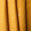 Luxurious golden mustard linen fabric with intricate embroidery and embellishments