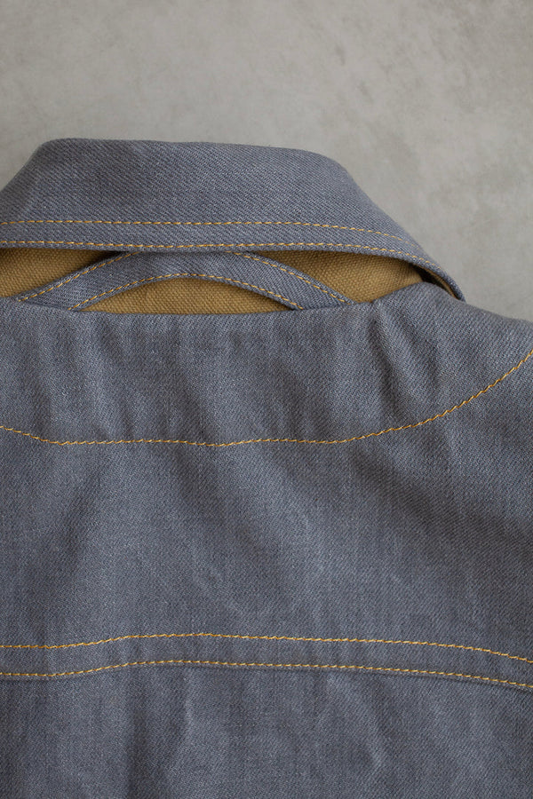 Jaime Jacket sewing pattern, highlighting a casual menswear design with a curved yoke, slit cuff openings, and unique dual front pockets, perfect for creating a smart, easy-to-wear jacket.