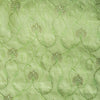 High-end vivid green linen fabric with subtle floral embroidery for luxury creations