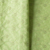 High-end vivid green linen fabric with subtle floral embroidery for luxury creations