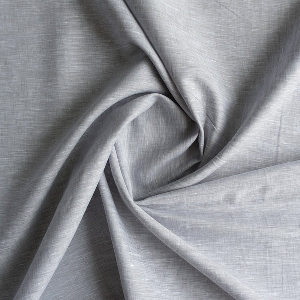 Chambray wave linen fabric with subtle slubs and a balance of grey and white threads