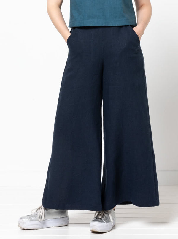Loddon Woven Pant sewing pattern, featuring wide-leg, full-length pants with elastic waist, flat front waistband, and angled pockets, suitable for washed linen, crepe, viscose, or fine wool fabrics.