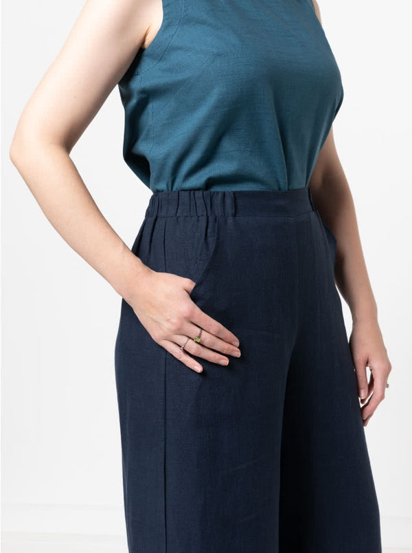 Loddon Woven Pant sewing pattern, featuring wide-leg, full-length pants with elastic waist, flat front waistband, and angled pockets, suitable for washed linen, crepe, viscose, or fine wool fabrics.