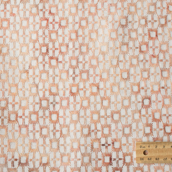 Light pink ombré embroidered linen fabric with gradient web-style embroidery for elegant fashion and home decor.