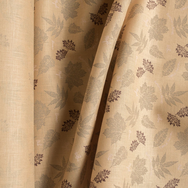 Nature-inspired Sand & Leaves linen fabric with a soft grip and leaf prints, perfect for creating stylish summer garments.