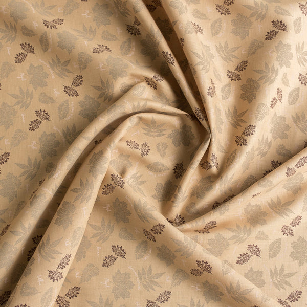 Nature-inspired Sand & Leaves linen fabric with a soft grip and leaf prints, perfect for creating stylish summer garments.