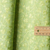 legant Sunny Lime Embroidered linen fabric with a chambray texture and green vine embroidery, ideal for sophisticated creations.