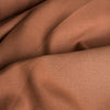 Rich, dark brown Tortoiseshell linen fabric, suitable for a range of stylish garments and cozy home textiles.