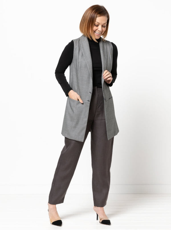 Andrea Woven Vest sewing pattern, featuring a long line vest with a shawl collar, sleeveless design, and optional pockets for a sleek and stylish garment.