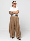 Atlas Woven Pant Sewing Pattern - wide leg crop pants with fitted waist, invisible zip, side inseam pockets, twisted pleat detail, and slight dropped crotch.