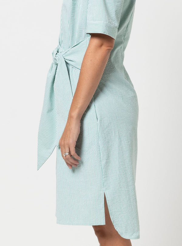 Light blue striped dress with a tie waistmade using Avon Woven Shirt and Dress sewing pattern on a white background