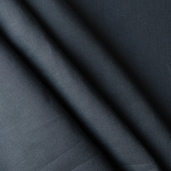 Close-up of darknavy blue linen fabric with folds