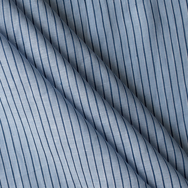 Close-up of Bluehaven Pinstripe linen fabric in pale blue with fine navy pinstripes, 100% linen, 140 GSM, 60 LEA yarn dyed