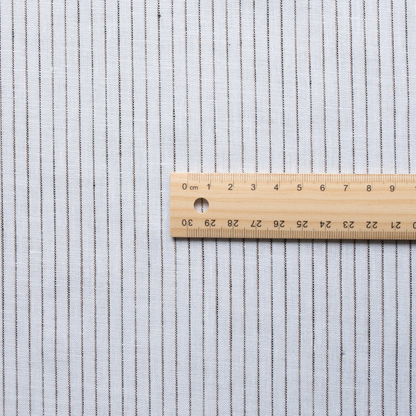 Sophisticated Chocolate Pinstripe Linen Fabric with natural slub texture, ideal for creating stylish and comfortable apparel.