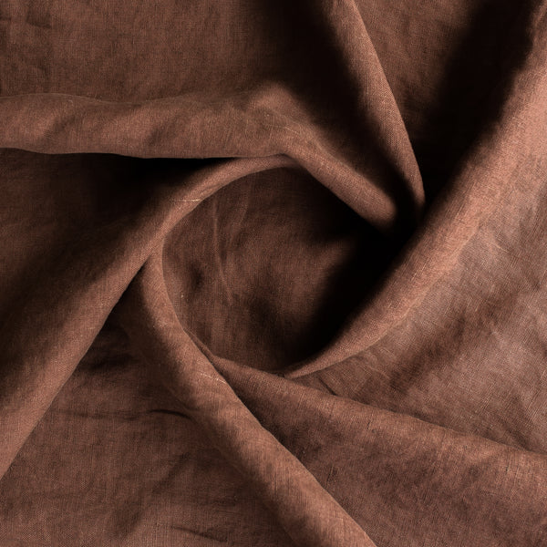 Close-up of Cocoa extra wide 100% linen fabricwith folds