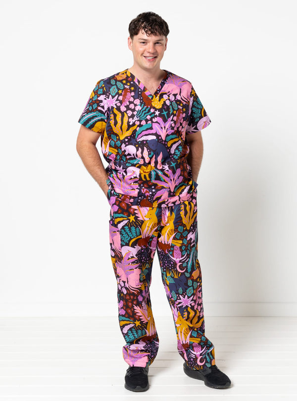 Person wearing a colorful patterned outfit on a white background