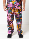 Person wearing colorful patterned pants on a white background