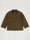 Quilted jacket with a brown collar on a white background