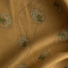 Golden Sketch Bloom linen fabric with golden mustard base and blue line-drawn floral design with green accent