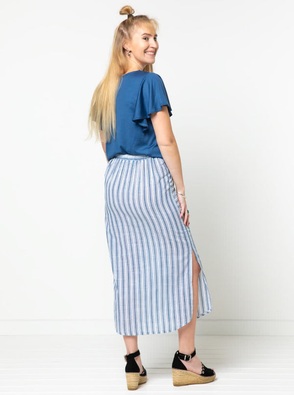 Indigo Maxi Skirt sewing pattern, featuring an elastic waist, faux button opening, patch pockets, and side splits, ideal for cotton, linen, crepe, or rayon fabrics.