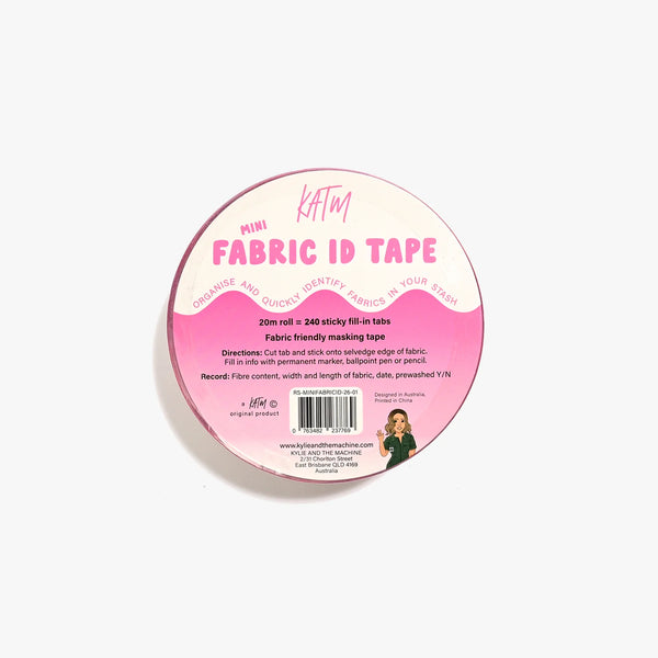 A roll of KAFM Mini Fabric ID Tape on a clean white background. The tape is pink and white, and the packaging features a pink and white label with product details and a barcode.