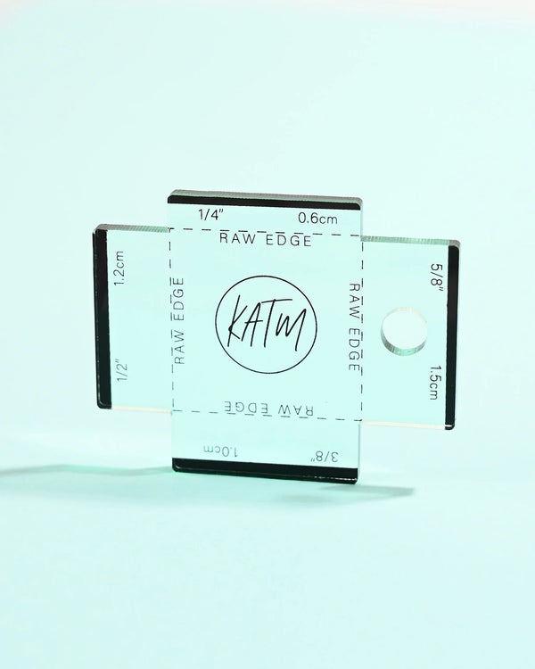 Clear ruler with measurement markings on a light blue background