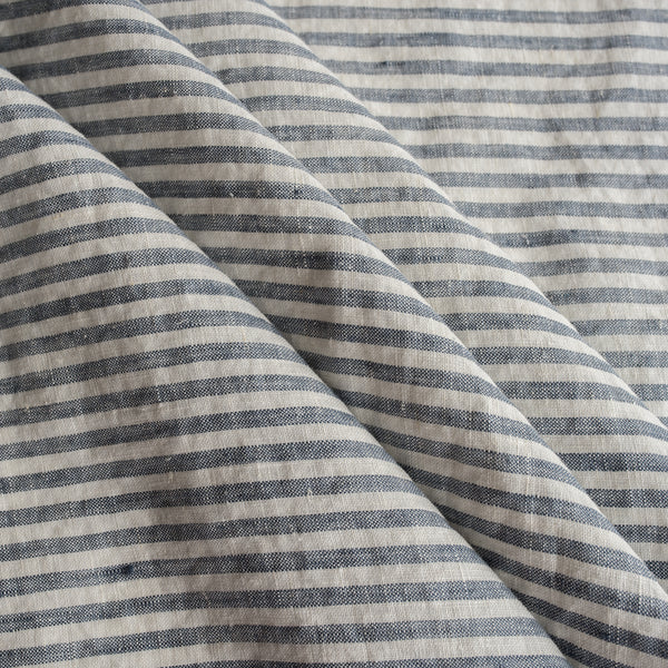 Close-up of blue and white striped Marine Stripe 100% Linen Fabric fabric