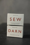Merchant & Mills Darn Box with darning egg, scissors, needles, and threader for garment repair