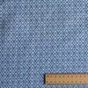 Blue diamond pattern fabric with a ruler for scale