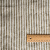 Olive Stripe 100% Linen Fabric with 0.5cm yarn-dyed stripes in olive green and off-white – extra wide, European Flax™ certified with a wooden ruler for scale