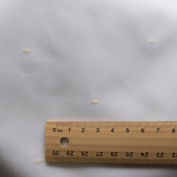 Pure White with Ivory Dot Giza Cotton Blend Fabric with small ivory embroidered dots on a white base