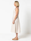 A sophisticated sleeveless dress with a high-waisted fitted bodice, gored skirt, and invisible zip, made from luxurious linen fabric.