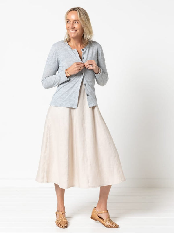 A sophisticated sleeveless dress with a high-waisted fitted bodice, gored skirt, and invisible zip, made from luxurious linen fabric.