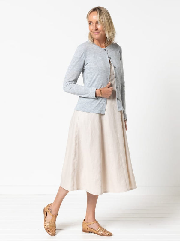 A sophisticated sleeveless dress with a high-waisted fitted bodice, gored skirt, and invisible zip, made from luxurious linen fabric.