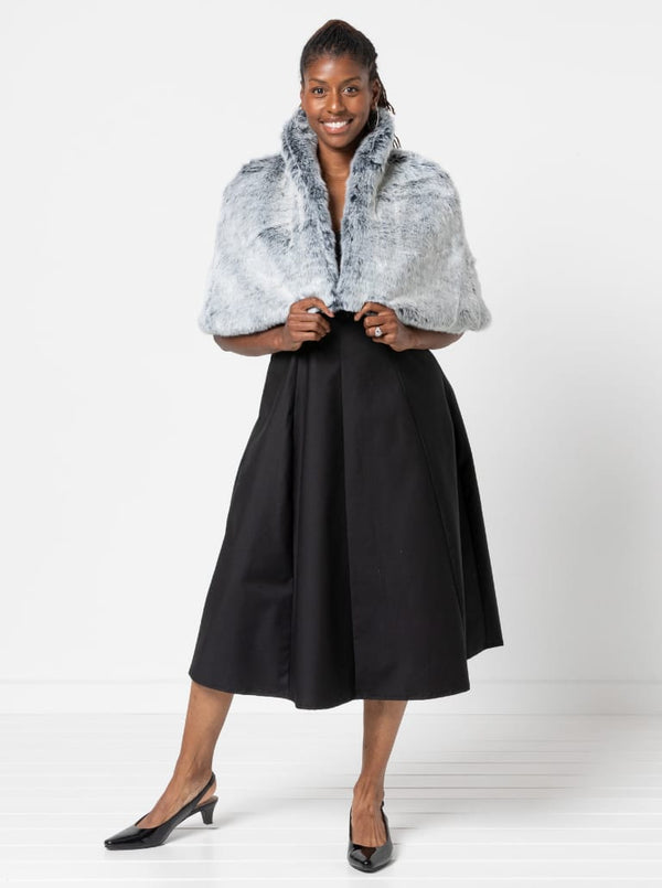 A sophisticated sleeveless dress with a high-waisted fitted bodice, gored skirt, and invisible zip, made from luxurious linen fabric.