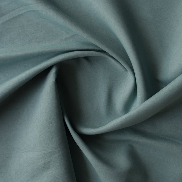 Close-up of teal fabric with folds