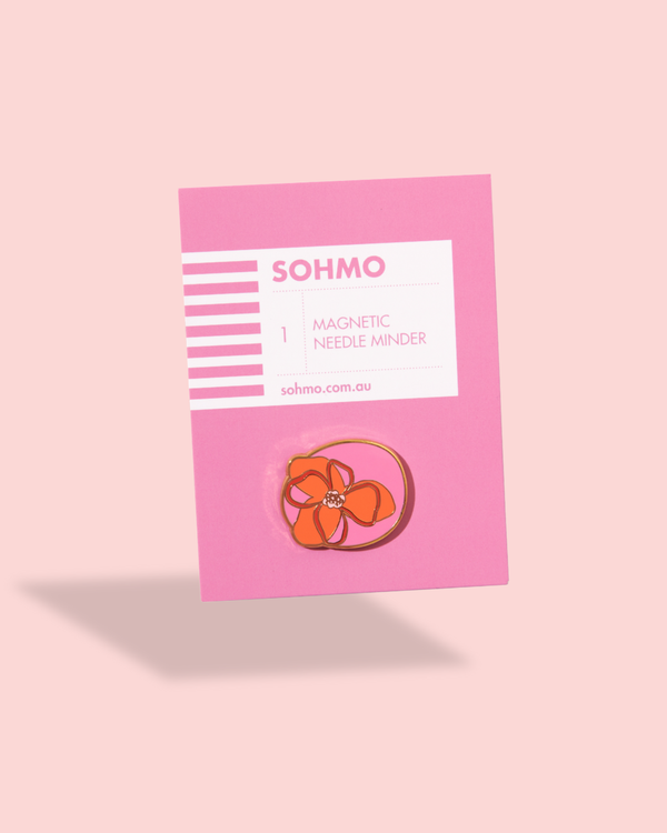 SOHMO magnetic needle minder on a pink card with a pink background