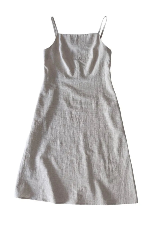 Light gray slip dress on a white background