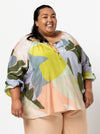 front view of Style Arc Anita Peasant Blouse Sewing Pattern with drawstring neck and raglan sleeves