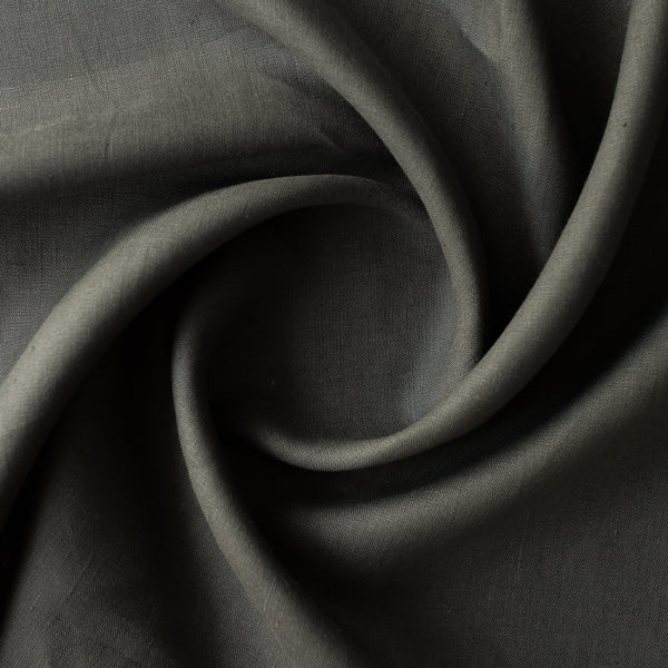 Close-up of Urban Moss deep grey-olive 100% linen fabric, 230 GSM, 25 LEA – close-up texture with a swirl pattern