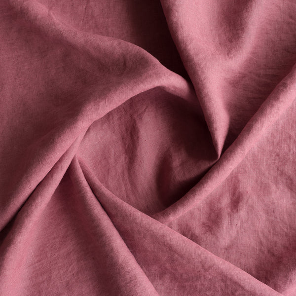 Close-up ofVintage Plum extra wide 100% linen fabric with folds