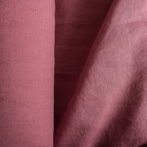 Close-up ofVintage Plum extra wide 100% linen fabric with a textured pattern