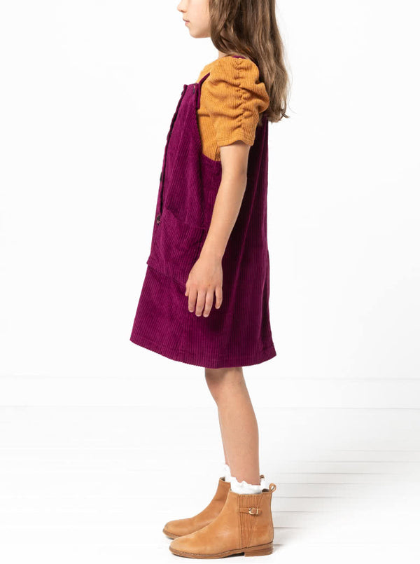 Style Arc’s Zoe Kids Pinafore pattern with button-through front and adjustable shoulder straps.