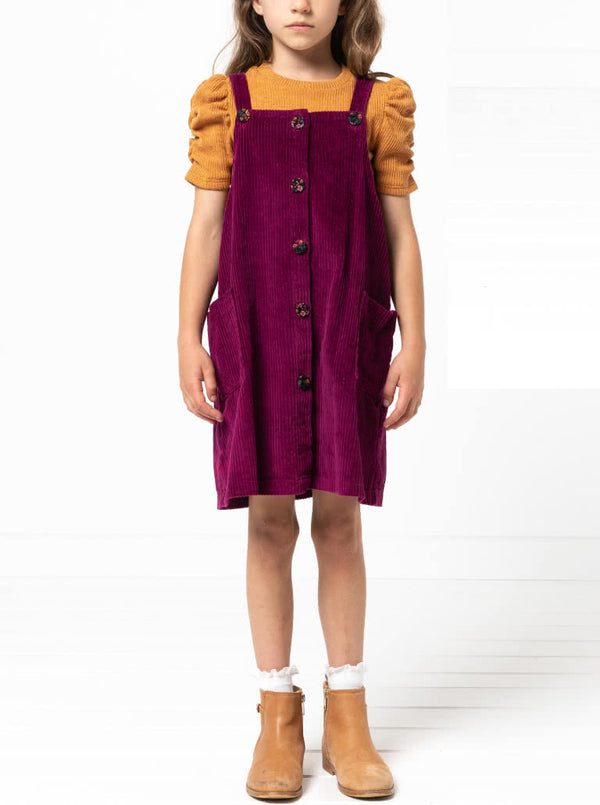 Style Arc’s Zoe Kids Pinafore pattern with button-through front and adjustable shoulder straps.