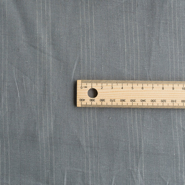 Elegant Chalk Stripe Charlie Linen Fabric with Geese grey background and subtle chalk stripes, ideal for fashion-forward and versatile clothing.